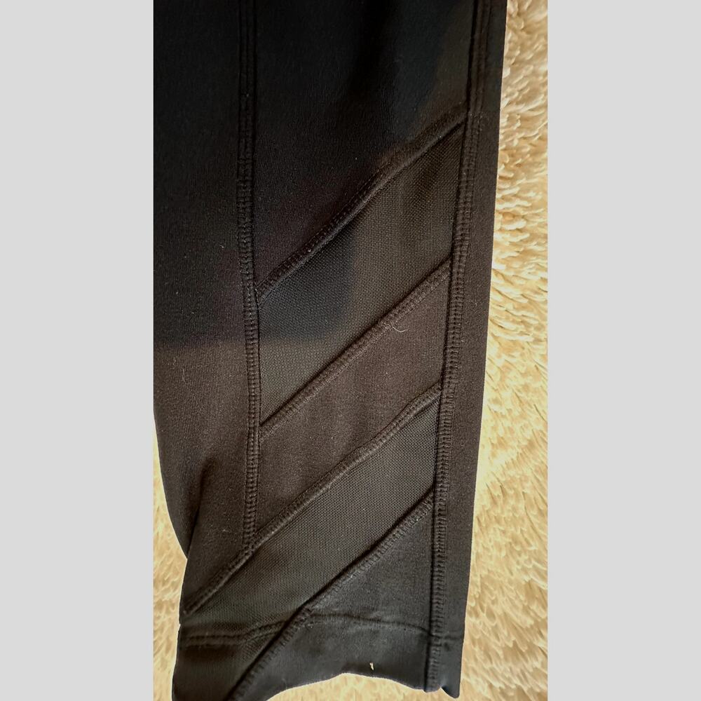 Mondetta Black leggings with peekaboo leg strips wmns sz L